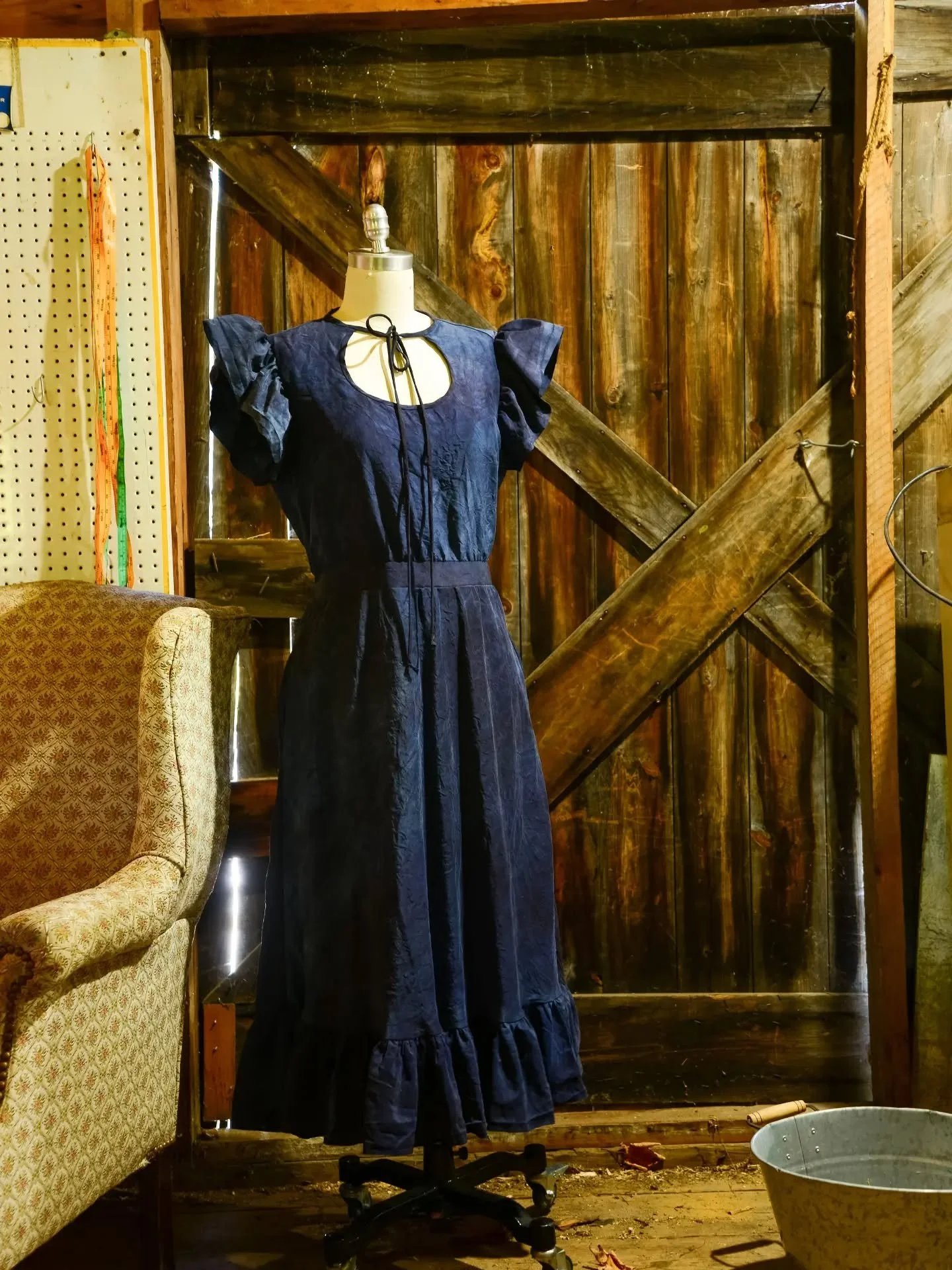 Silk taffeta dipped 6 times in indigo, once in logwood for a variegated, inky navy. Aggressive shoulder ruffles, because it was the week Dolly Parton died. Size large, one-of-a-kind, at the Common Ground Fair tomorrow.