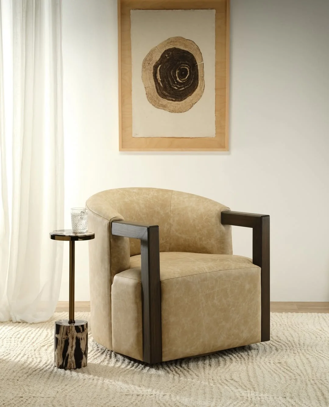 Curved, swivel, and effortlessly refined&mdash;the Casper Chair from @burtonjamesinc pairs sleek lines with exposed wood arms, adding a touch of sophistication to any space.