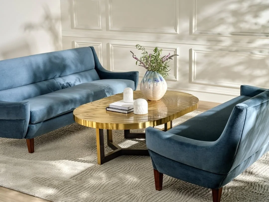 New classics in conversation&mdash;the sculptural Prescott Coffee Table from @madegoods anchors two timeless Hawkins Sofas, creating a space where texture, form, and function seamlessly meet.
