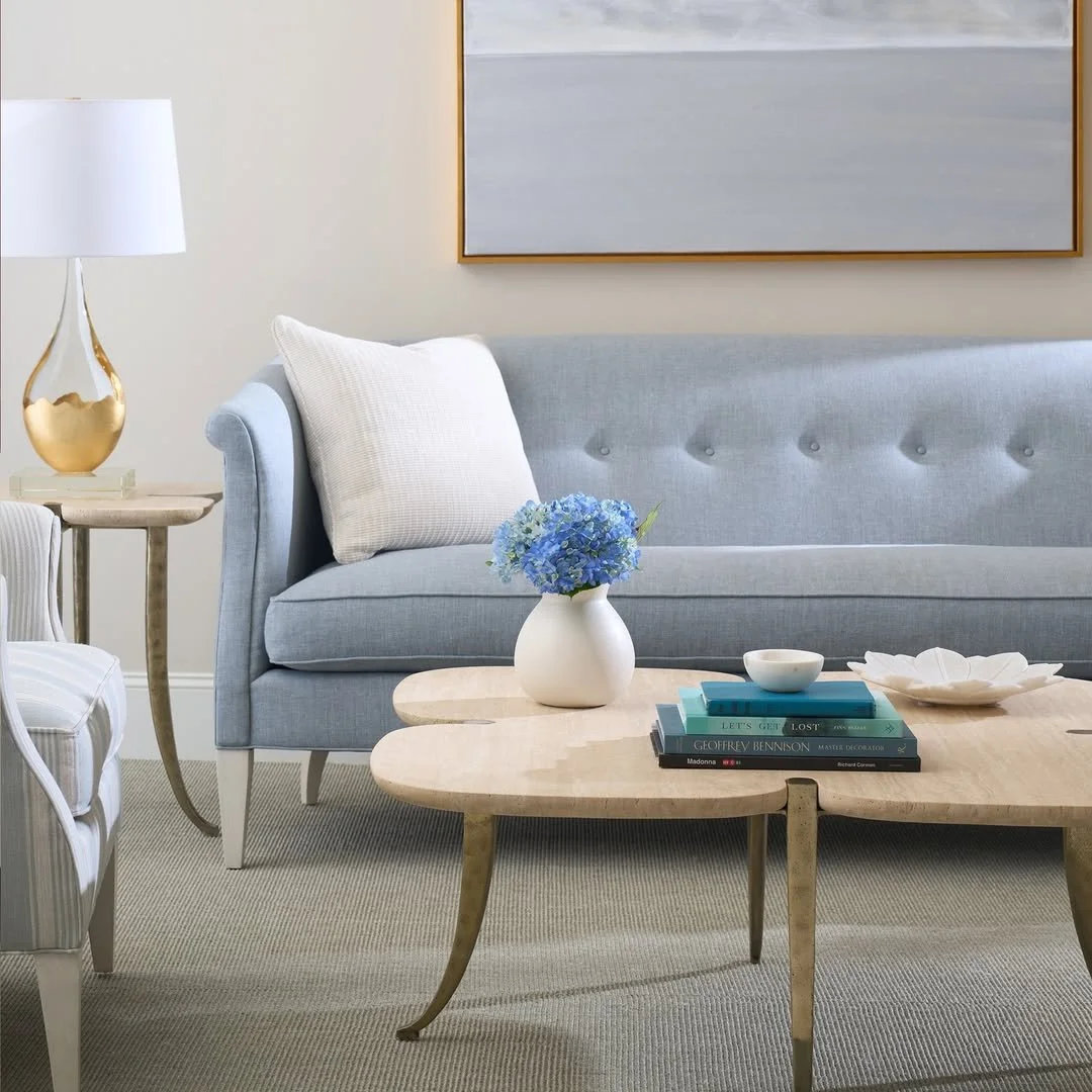 Timeless elegance meets natural charm&mdash;@hickorychair&rsquo;s Albert Sofa reimagines Federal period design with a button-tufted back and gracefully flared arms, while the Clover Cocktail and End Tables bring organic texture and warmth with honed 