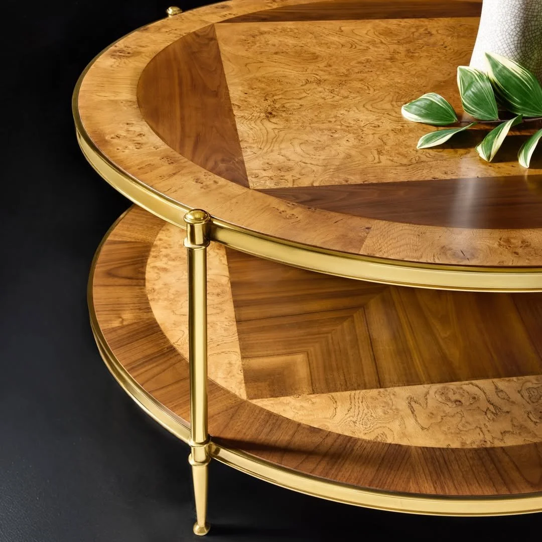 Crafted to captivate from every angle.

The Oak Burl &amp; Walnut Round Cocktail Table by @modernhistoryfurniture brings contrasting wood grains together with polished brass accents&mdash;an artful balance of precision, warmth, and timeless beauty.