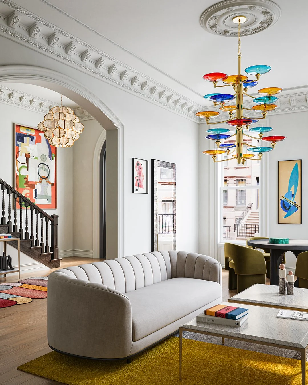The Veneto Large Chandelier by @curreyco draws on mid-century Italian design, crowned with dramatic blue, red, and yellow discs set atop gleaming gold arms. Milano-inspired and grand in scale, the 21-light fixture rises over four feet tall&mdash;comm