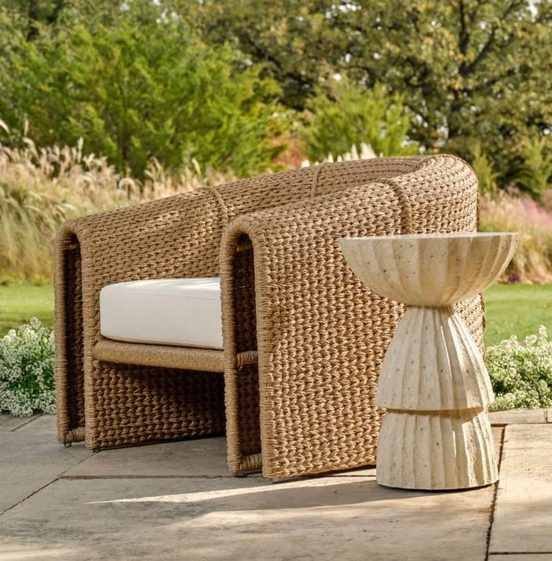 Sculptural. Inviting. Effortlessly at ease.

The Julien Open Arm Outdoor Lounge Chair from @arteriorshome pairs a draped, fluid silhouette with a continuous-loop handwoven technique &mdash; artisanal texture set against the clean geometry of its open