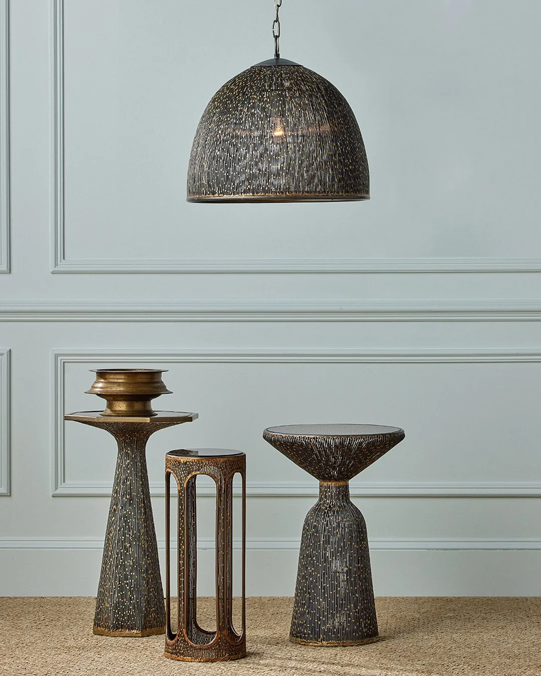 Texture, elevated to art.

The Eduardo Collection from @curreyco is defined by a richly layered patina &mdash; strands of slender iron wires welded and brazed by hand to create a distinctive, pebbled surface.

When illuminated, subtle gold-flecked hi