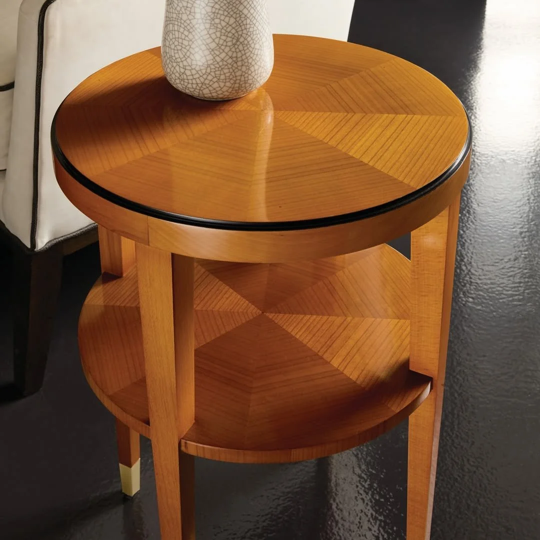 Elegance, distilled.

The newly introduced Langford Round Chairside Table (MH1273F02) from @modernhistoryfurniture pairs radiating cherry veneer with a refined hint of ebony inlay and gleaming brass-capped feet.

Its slim proportions and two-tiered f