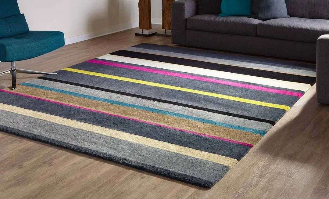 Lines That Move the Room

The DOUGLAS design by @creative_accents brings rhythm and movement to the floor through bold, directional striping and layered color. Graphic yet grounded, it adds structure to a space while still feeling playful and modern.