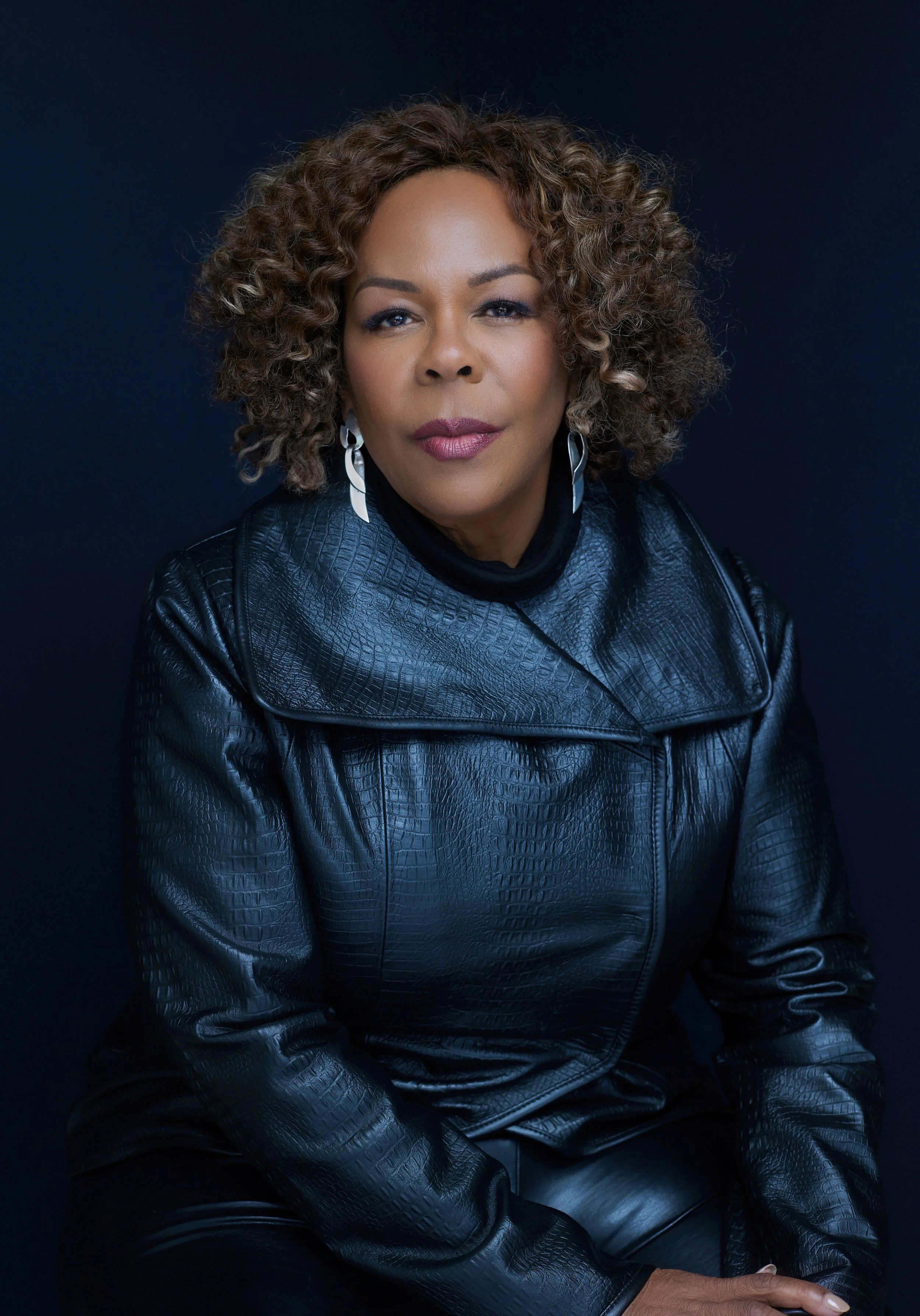 Beautiful black woman over 60 in a leather jacket