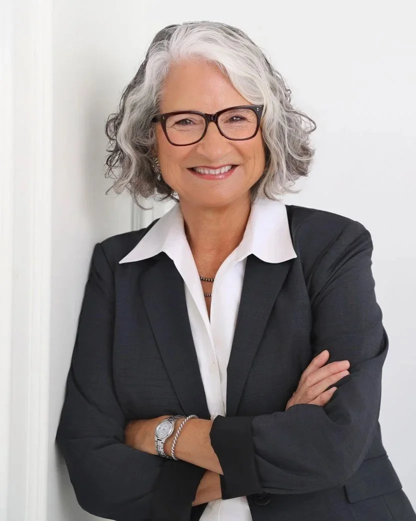 Confident mature woman posing for a headshot