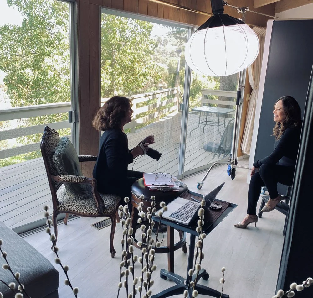 50overPhotographer photographing a happy client