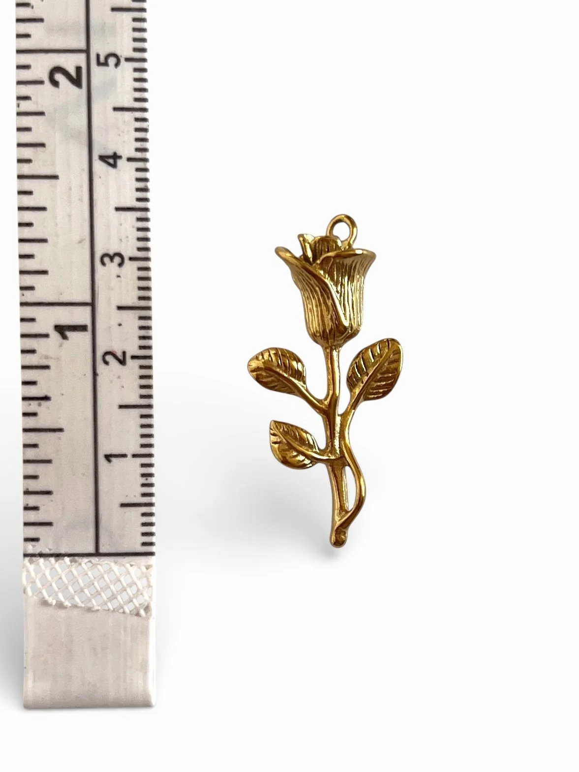 Gold rose flower charm with stem and leaves