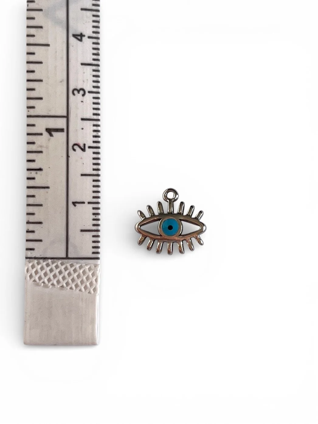 Silver evil eye charm with blue center