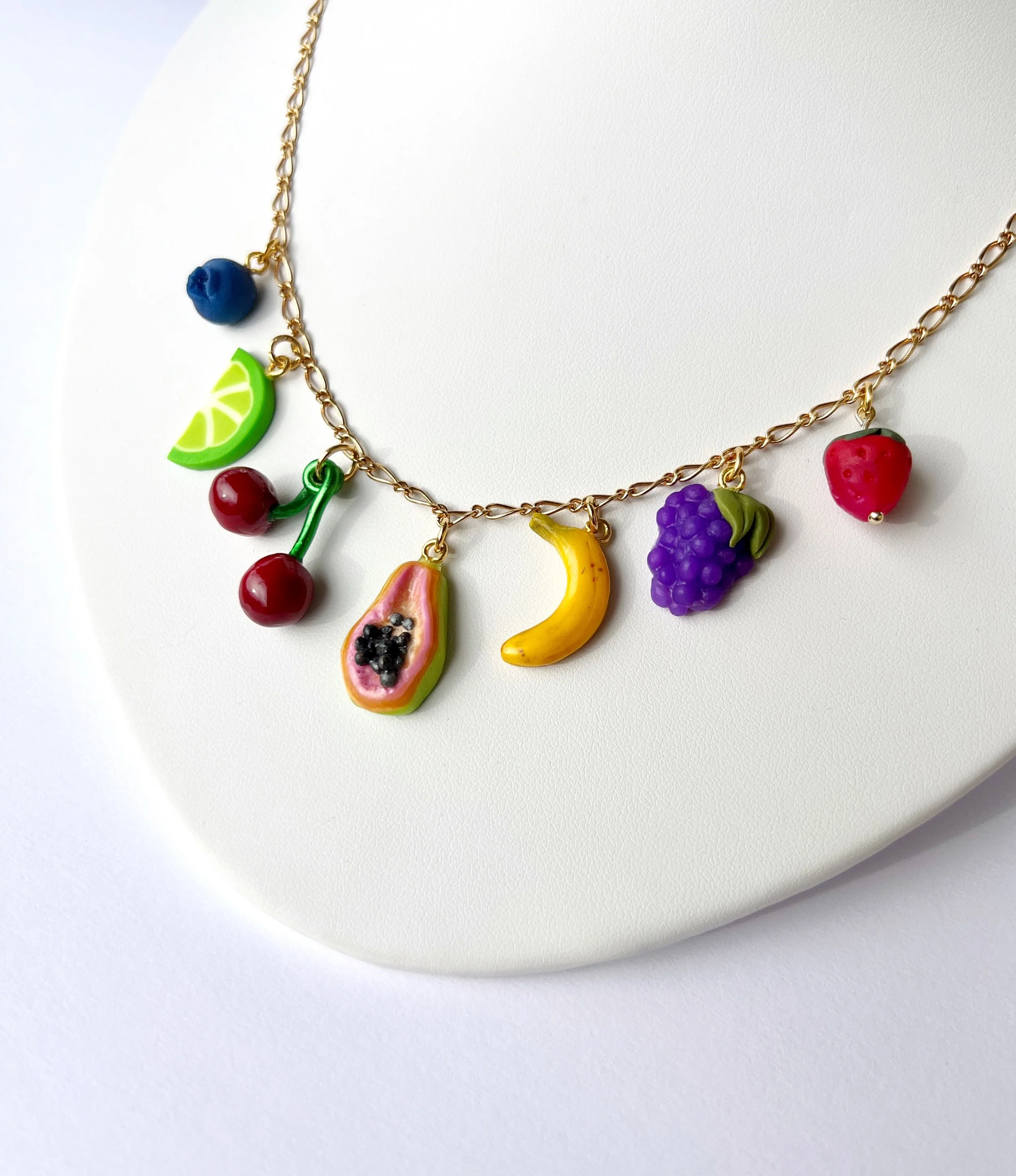 handmade fruit charms hanging on necklace