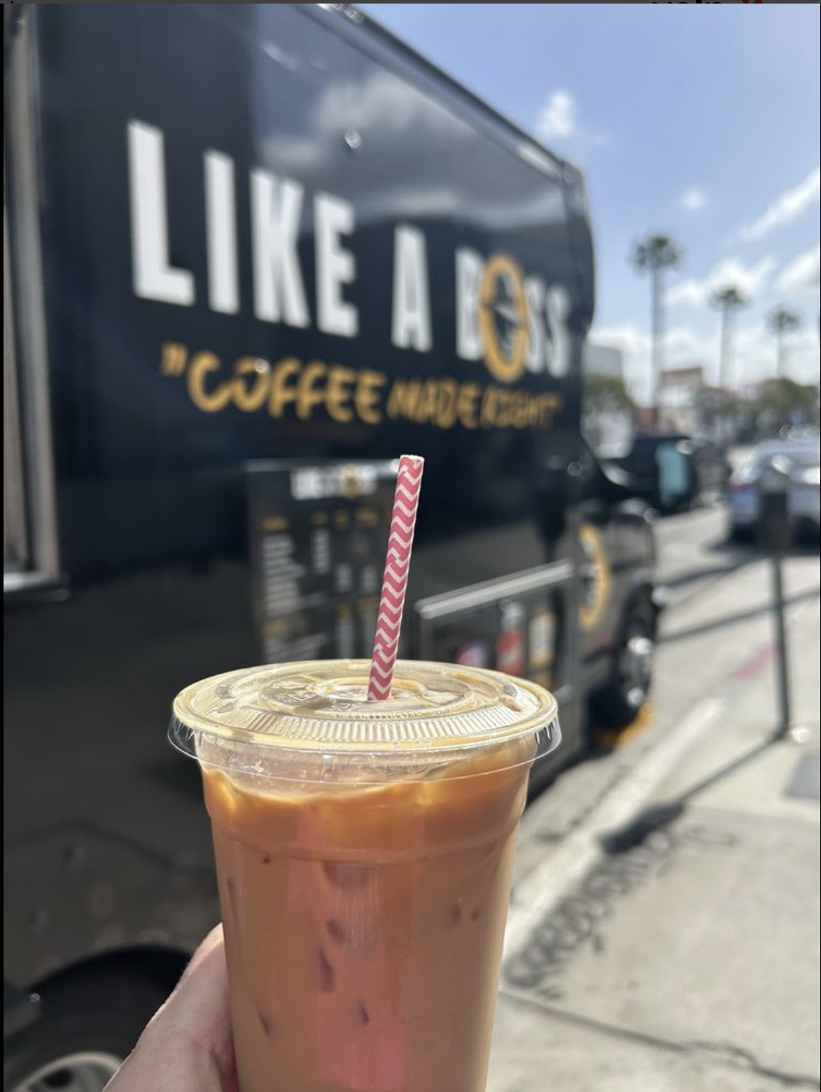 Iced coffee in front of coffee truck