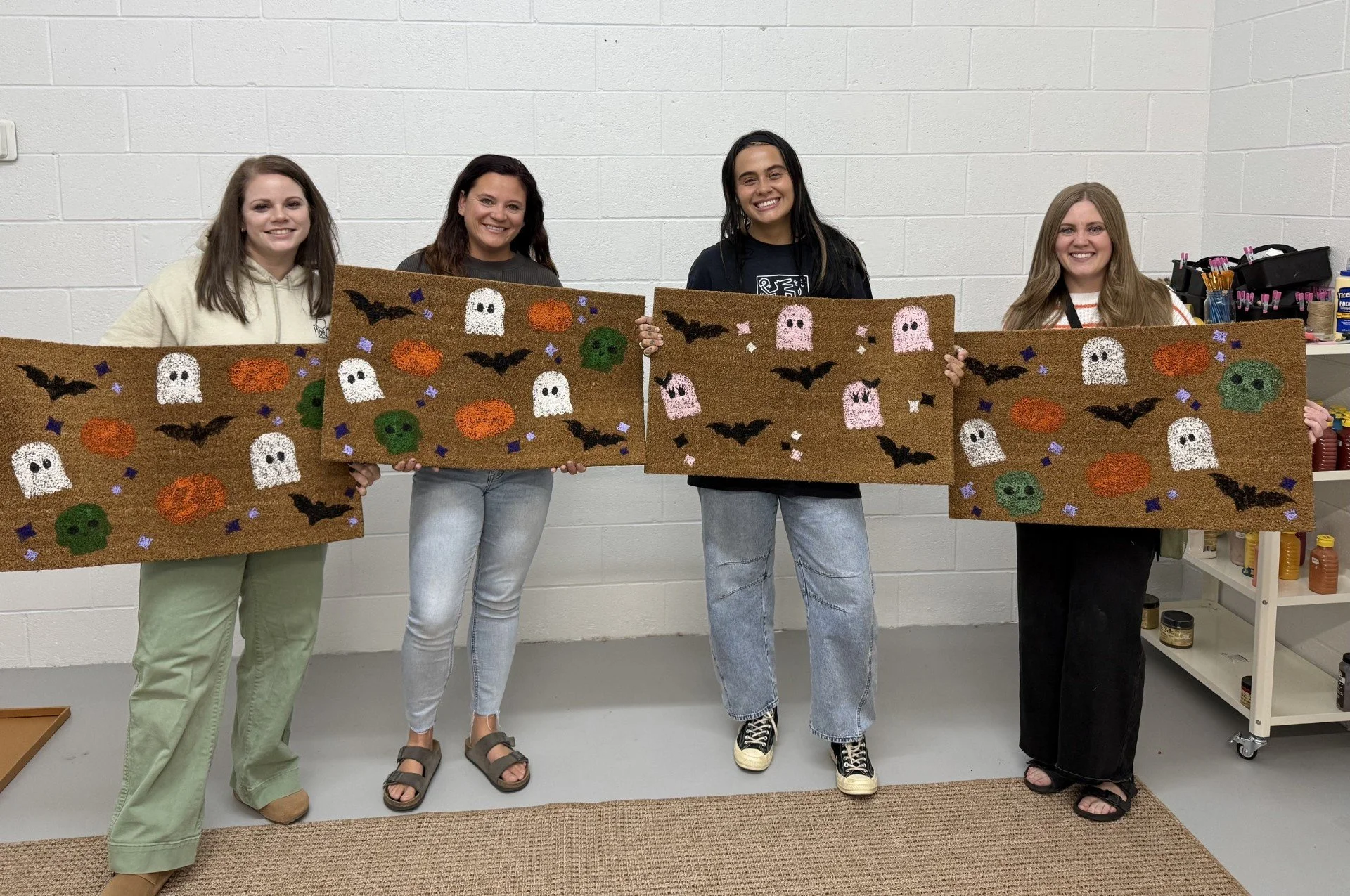 The Happy Hour Homemaker - people holding Fall Festival Doormats at Green Acres.jpg