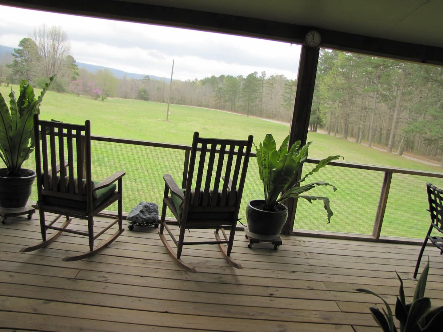 Peace Valley offers a beautiful view with mountains in the background and the gentle sound of a running creek. This is from the screened in porch of the shared deck..jpeg