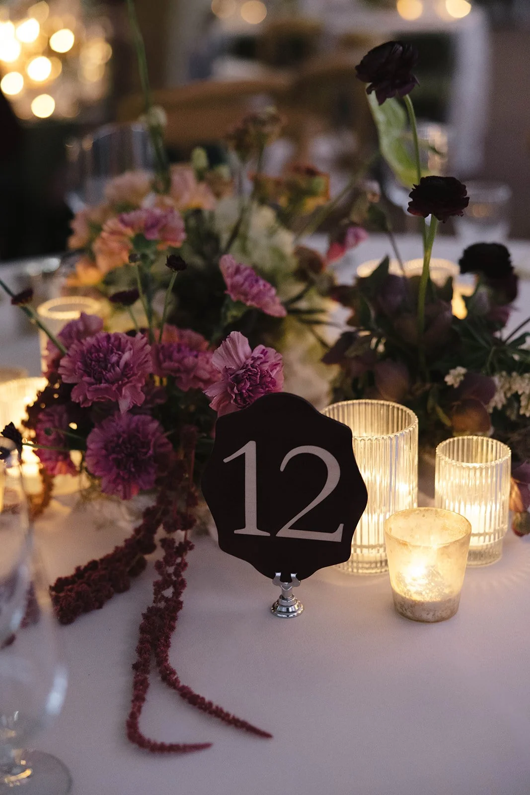 Luxury California wedding reception featuring a candlelit table with lush florals, layered linens, and elegant olive velvet chairs. A timeless, editorial-inspired design creating a romantic and unforgettable guest experience.

Luxury California weddi