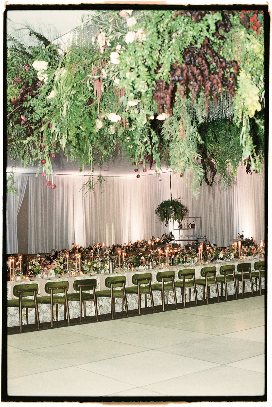 Luxury California wedding reception featuring a candlelit table with lush florals, layered linens, and elegant olive velvet chairs. A timeless, editorial-inspired design creating a romantic and unforgettable guest experience.

Luxury California weddi