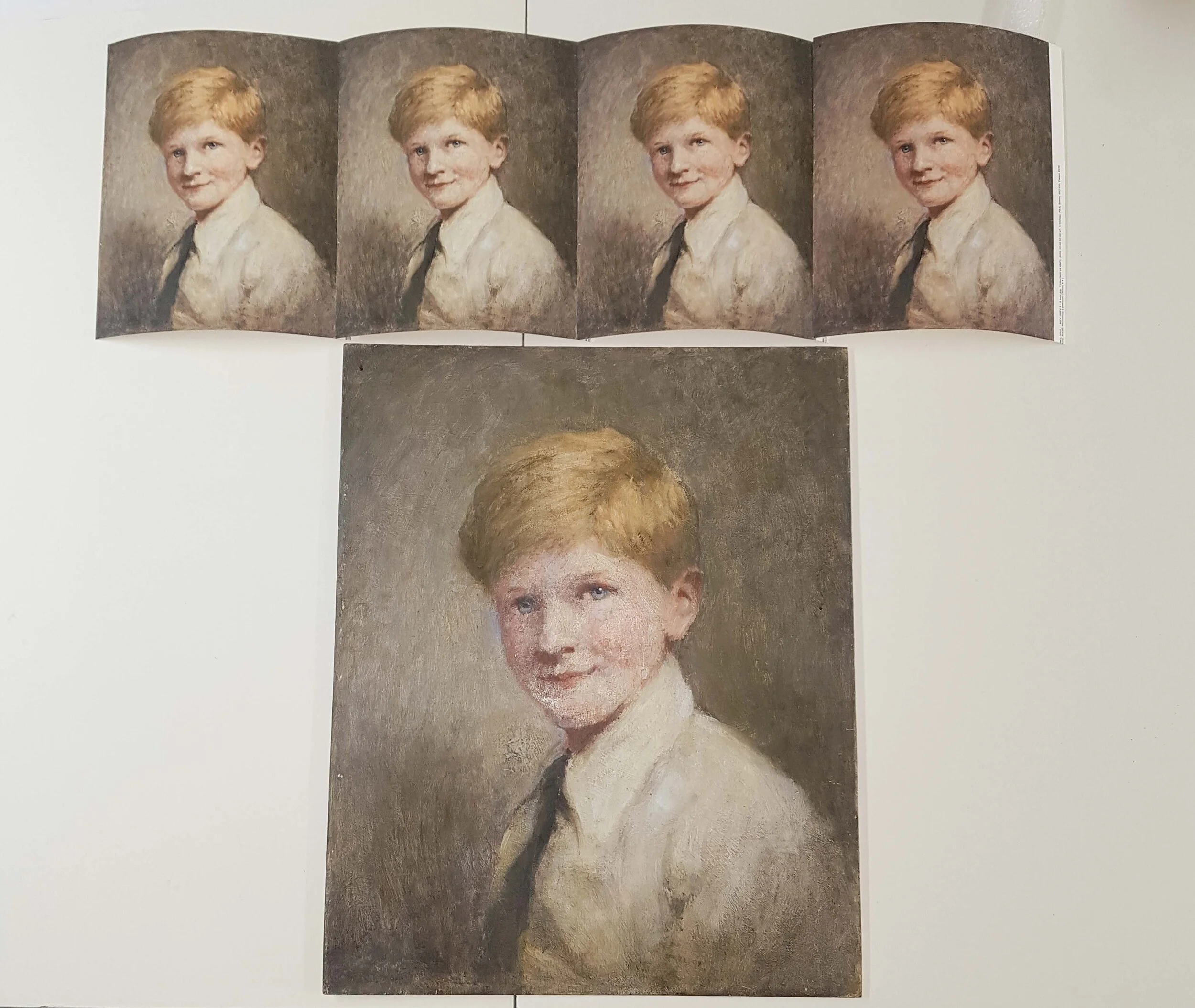An open booklet displaying a repeating portrait of a young boy with blond hair, wearing a white shirt and a dark tie, along with a larger standalone painting of the same boy in a similar pose, all set against a neutral background.