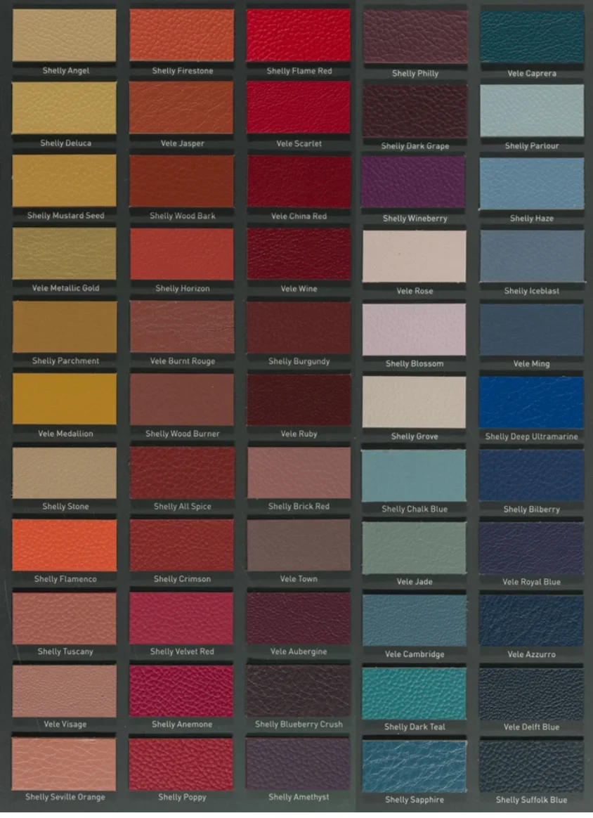 A display of various textured leather or fabric fabric color samples arranged in a grid with labels.