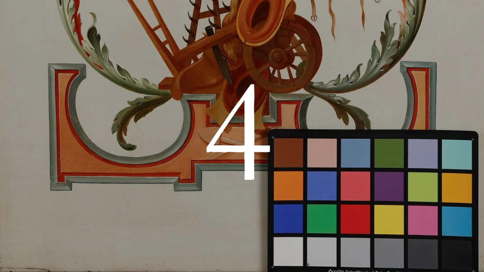 Close-up of a detailed ornamental painting featuring a wooden wheel, scrolls, and foliage, with a color calibration chart and a large white number four overlayed.