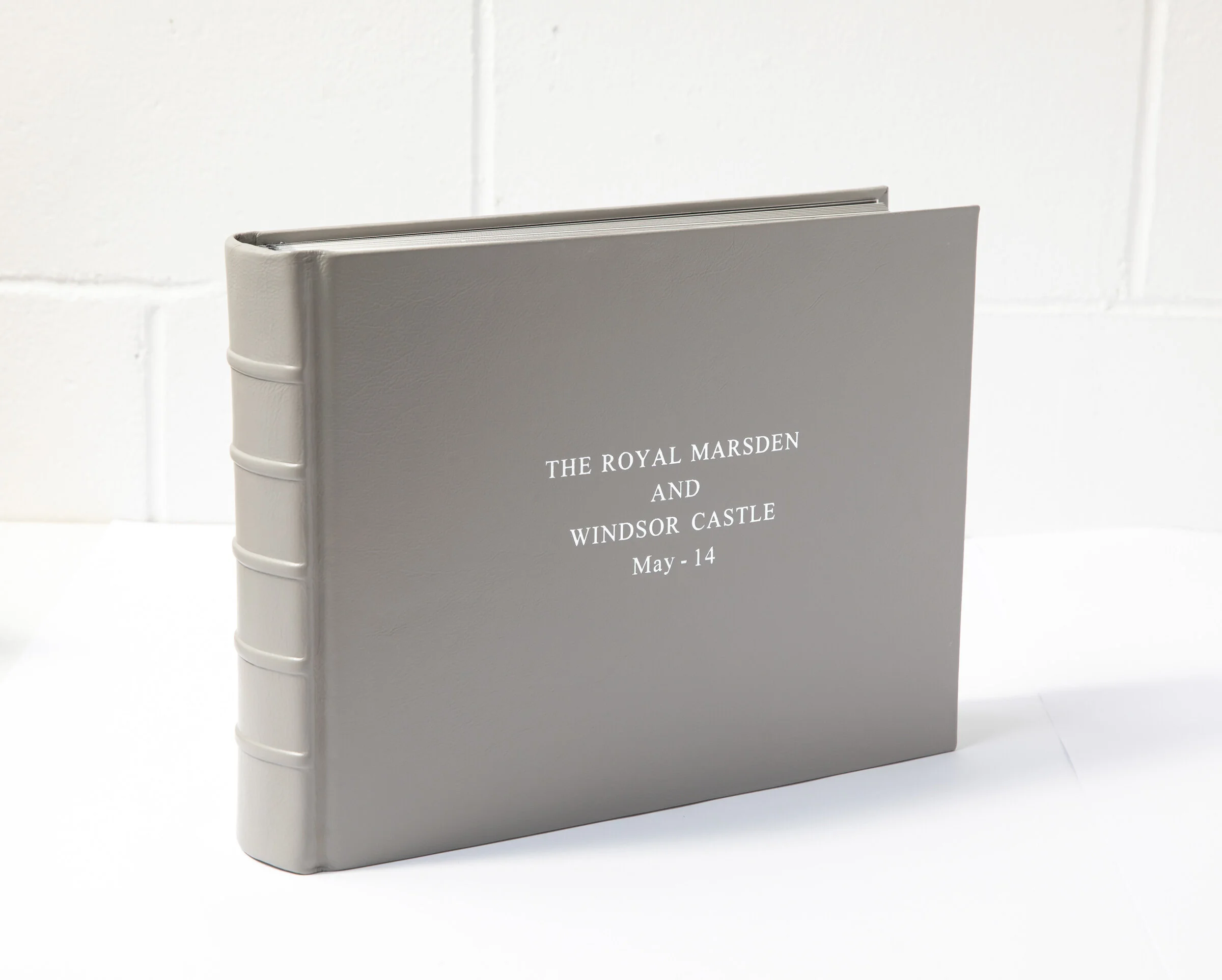 Gray photo album with white text that reads "The Royal Marsden and Windsor Castle May - 14" on the cover, set against a white background.