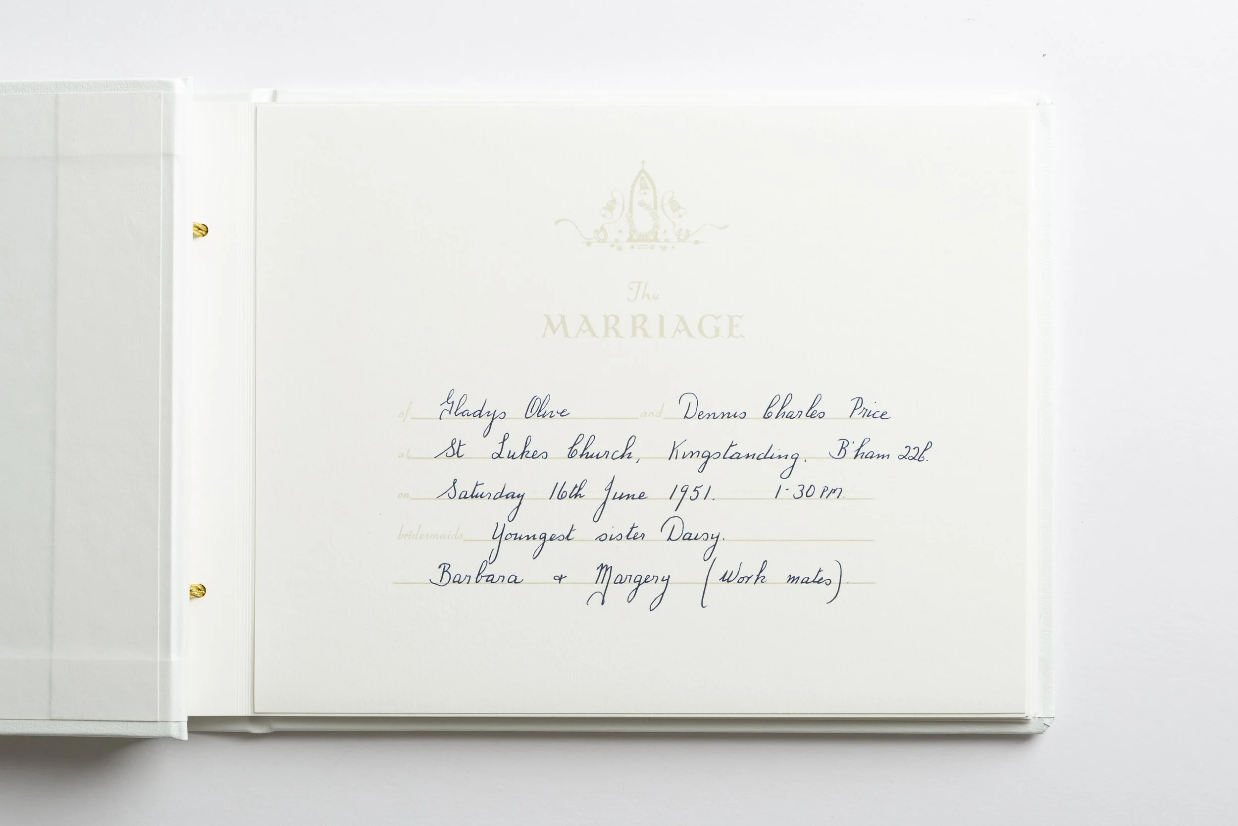 A wedding program with elegant font and gold-embossed title 'The Marriage' at the top, handwritten guest names, date, time, and location information.