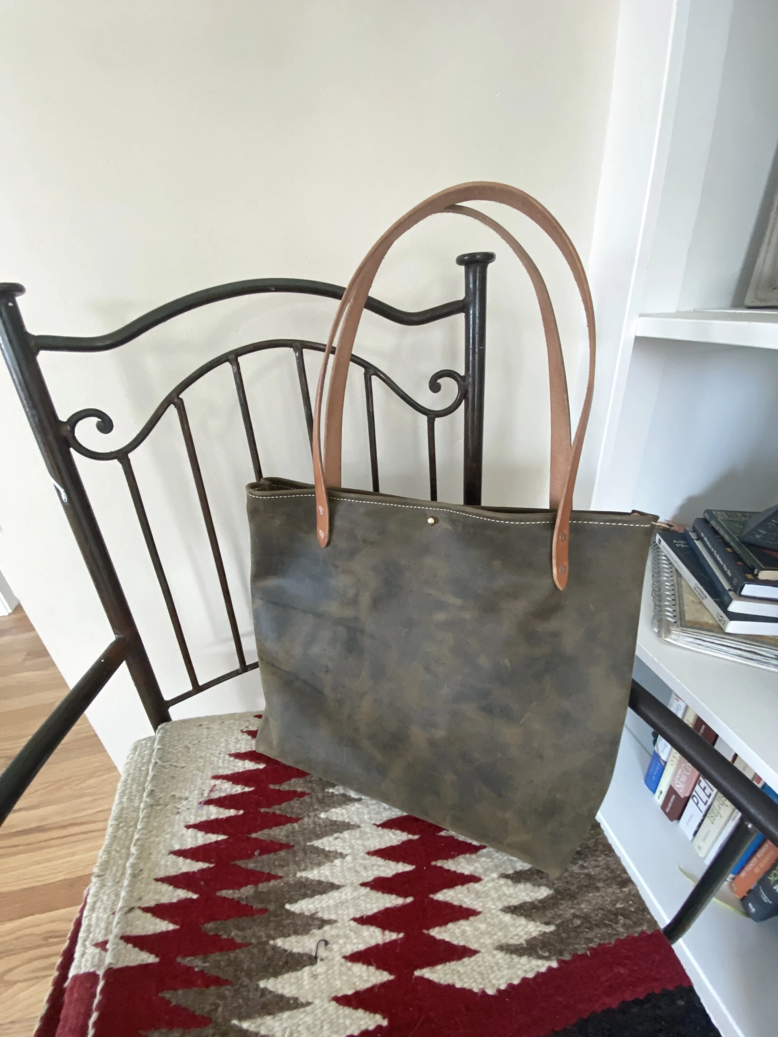Simple Tote with brown distressed pull-up leather. Natural, oiled straps and stud closure. 
