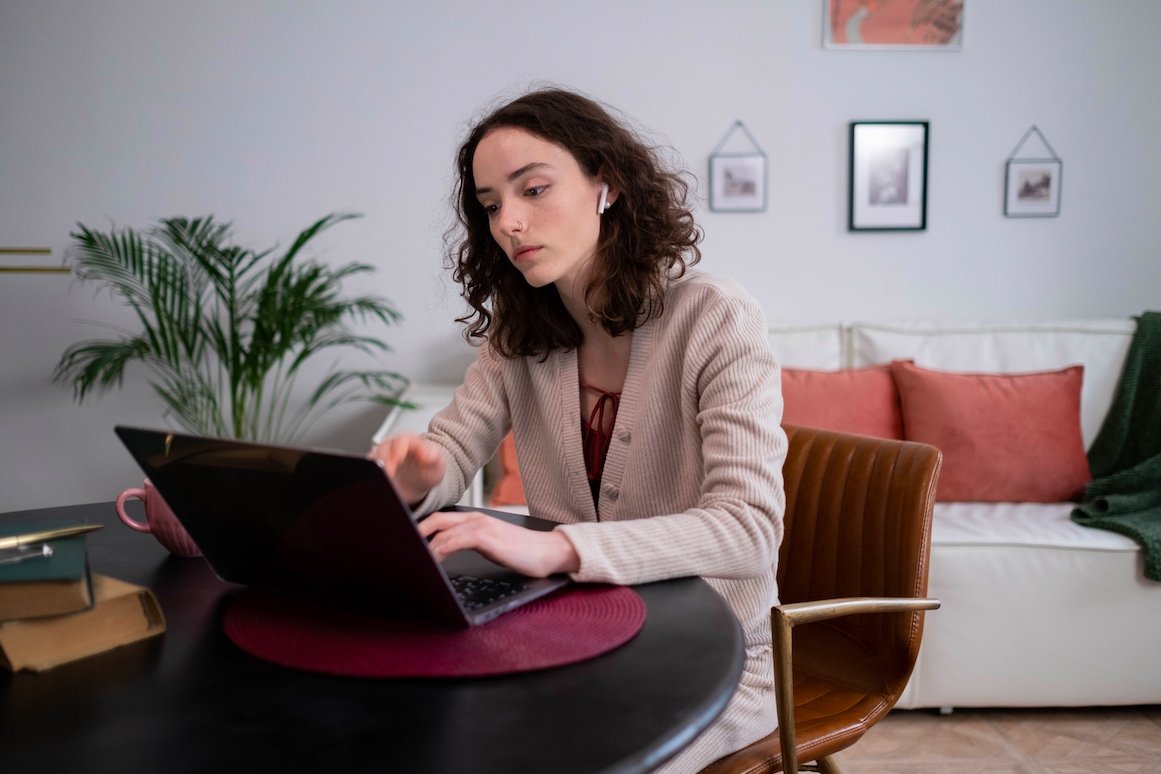 woman working on laptop at home