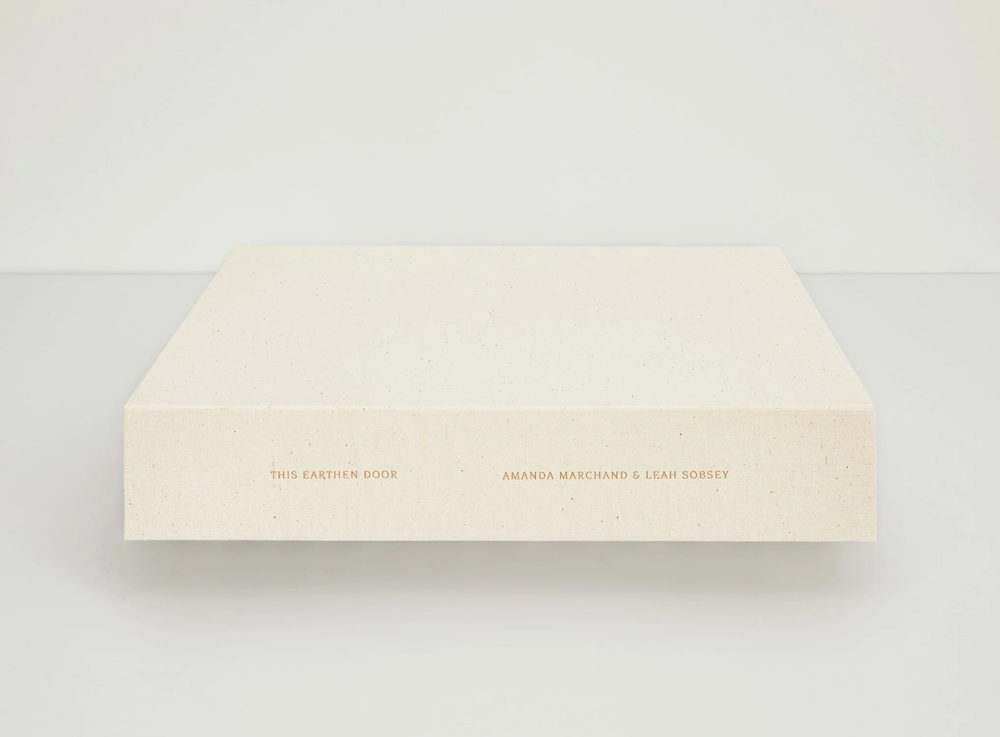 Amanda MARCHAND & Leah SOBSEY 
 This Earthen Door portfolio , 2023 
100 archival pigment prints contained in two custom buckram covered folios housed within a clamshell box; each folio with colophon and title sheets. Number 1 from an edition of 9 plu