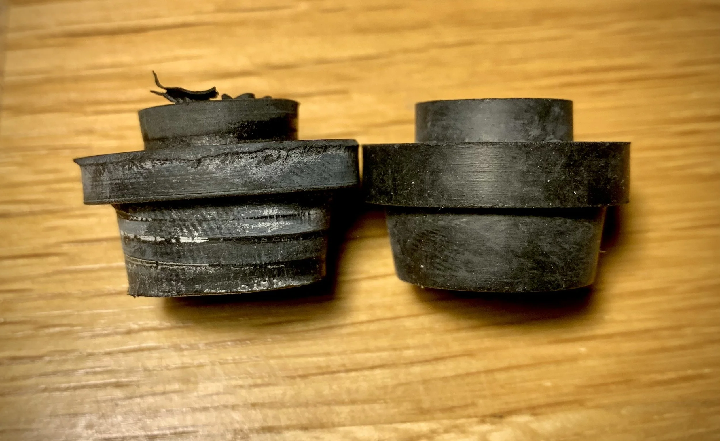 Old vs new upper suspension grommets.