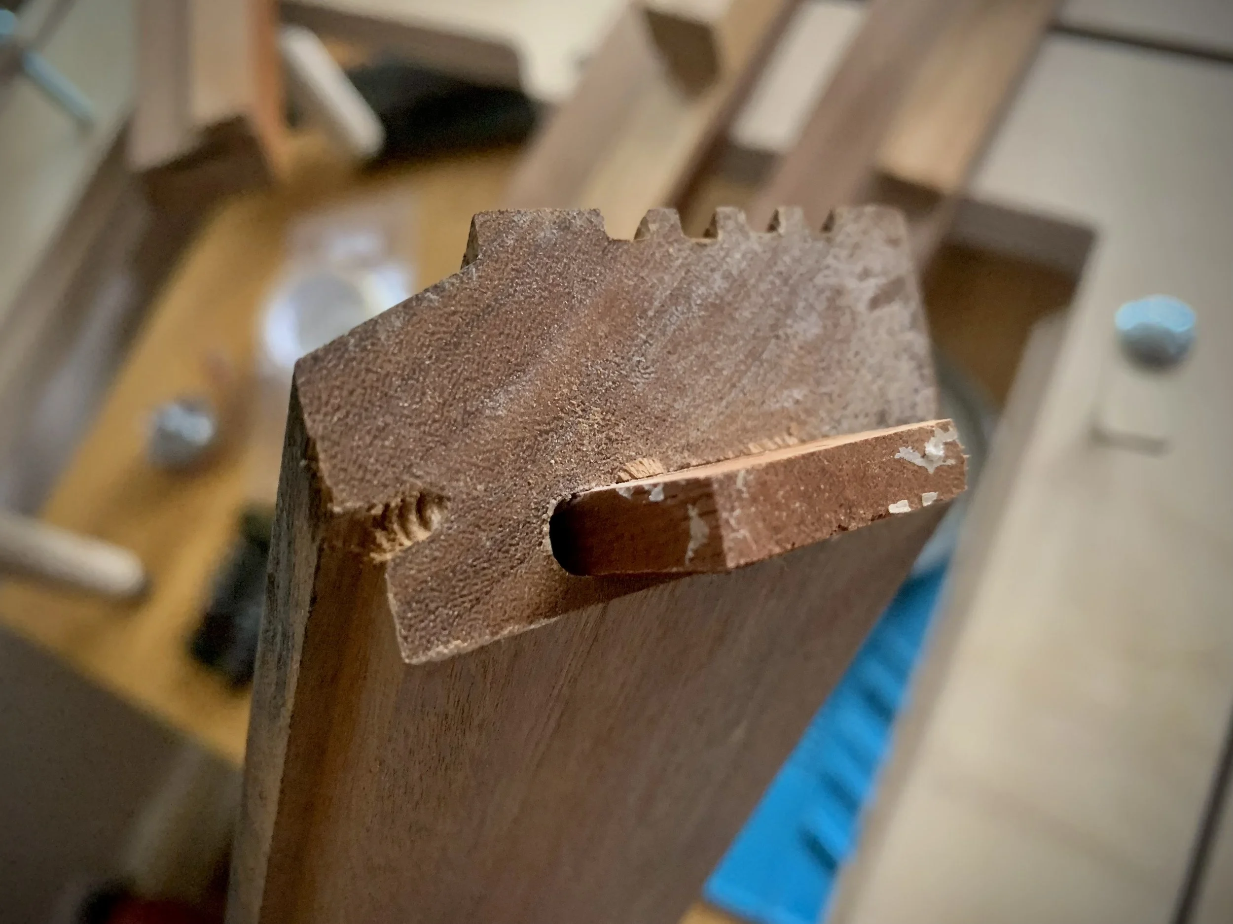 Complete failure of plinth mitres requiring resurfacing and regluing.