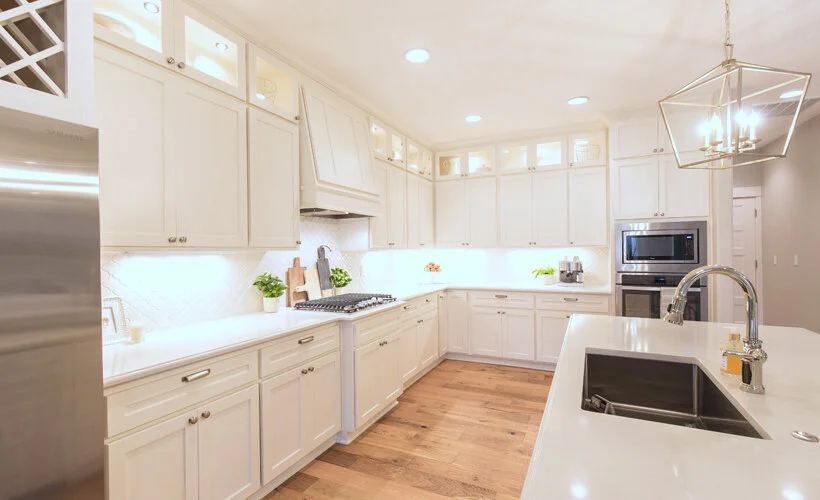 A modern yet timeless kitchen in Salem, Oregon with alabaster white shaker cabinets and Carrara Quartz countertops.