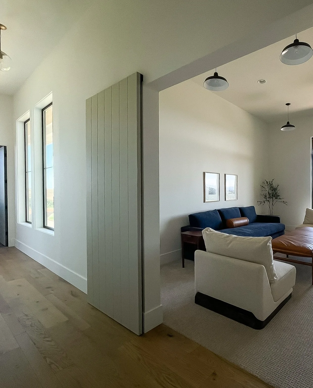 This cozy play room and media space is the perfect spot for kids to play or hang out without leaving the main floor. It's a versatile area great for family movie nights, building forts, or cozying up with a good book.