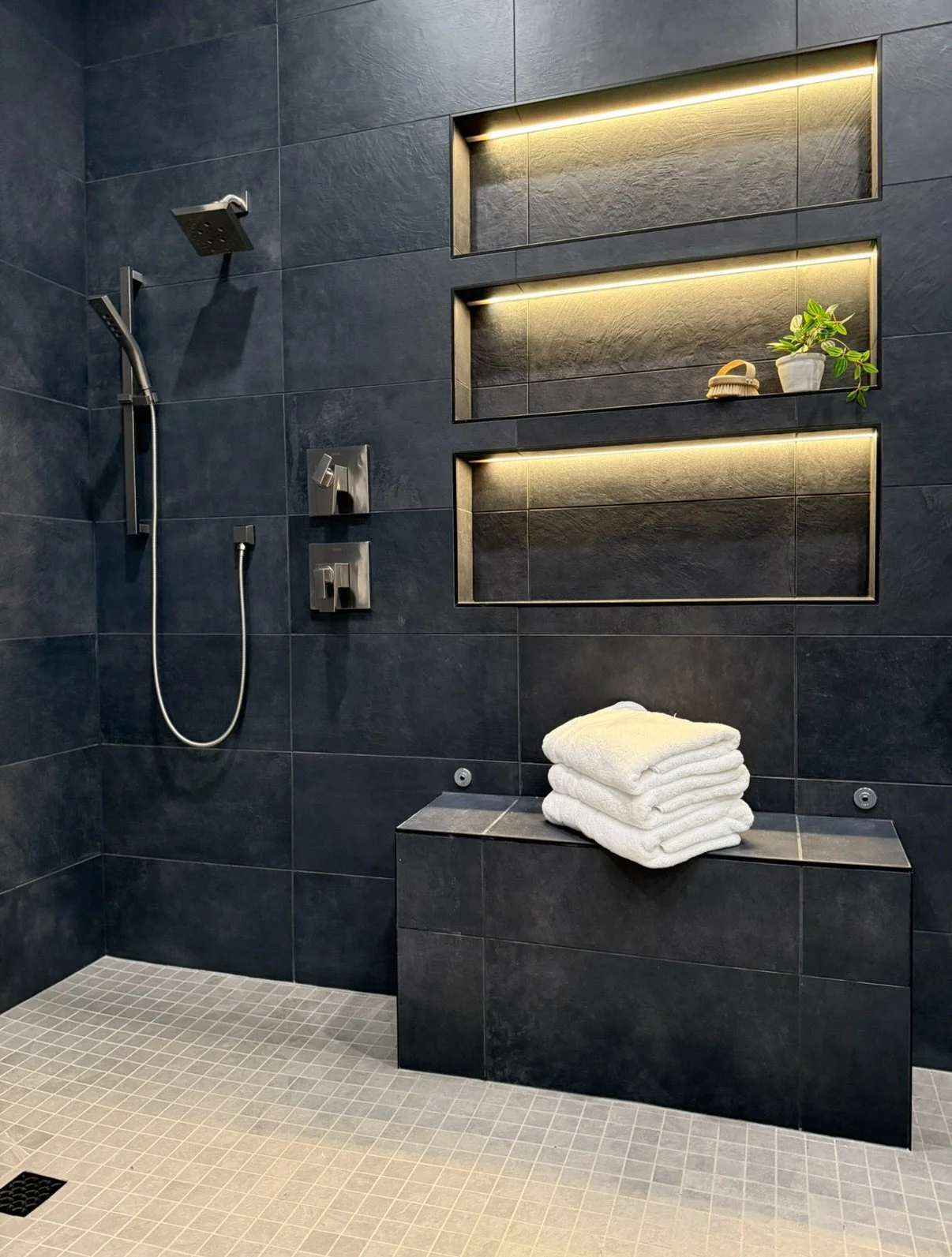 Excited to share this bathroom glow up with you. We started with an extremely spacious footprint, two closets, two large vanities, and one small shower. It was transformed into a large double shower, sauna, and double vanity with tons of storage. We 