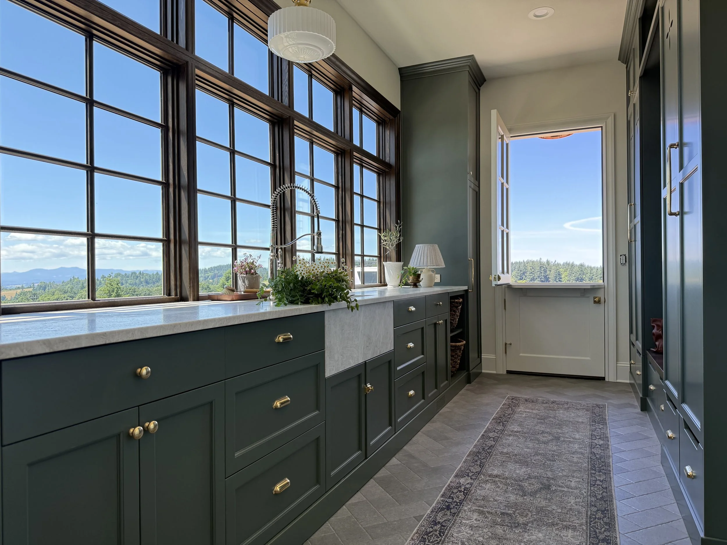 Mudroom with Custom Cabinetry and quartzite countertops by award winning Fridley Custom Homes