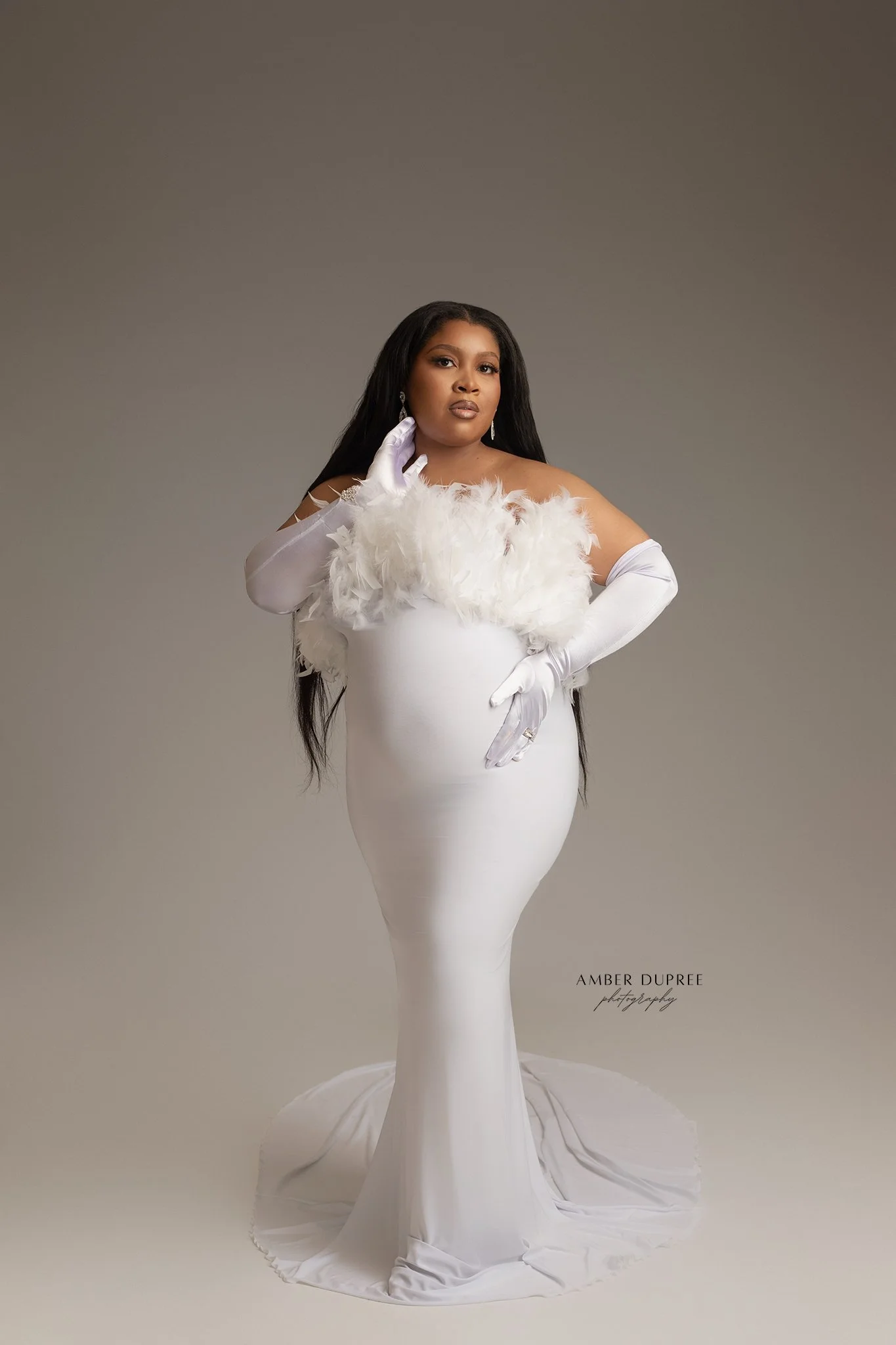 Minimal white maternity photography highlighting pregnancy and parent connection