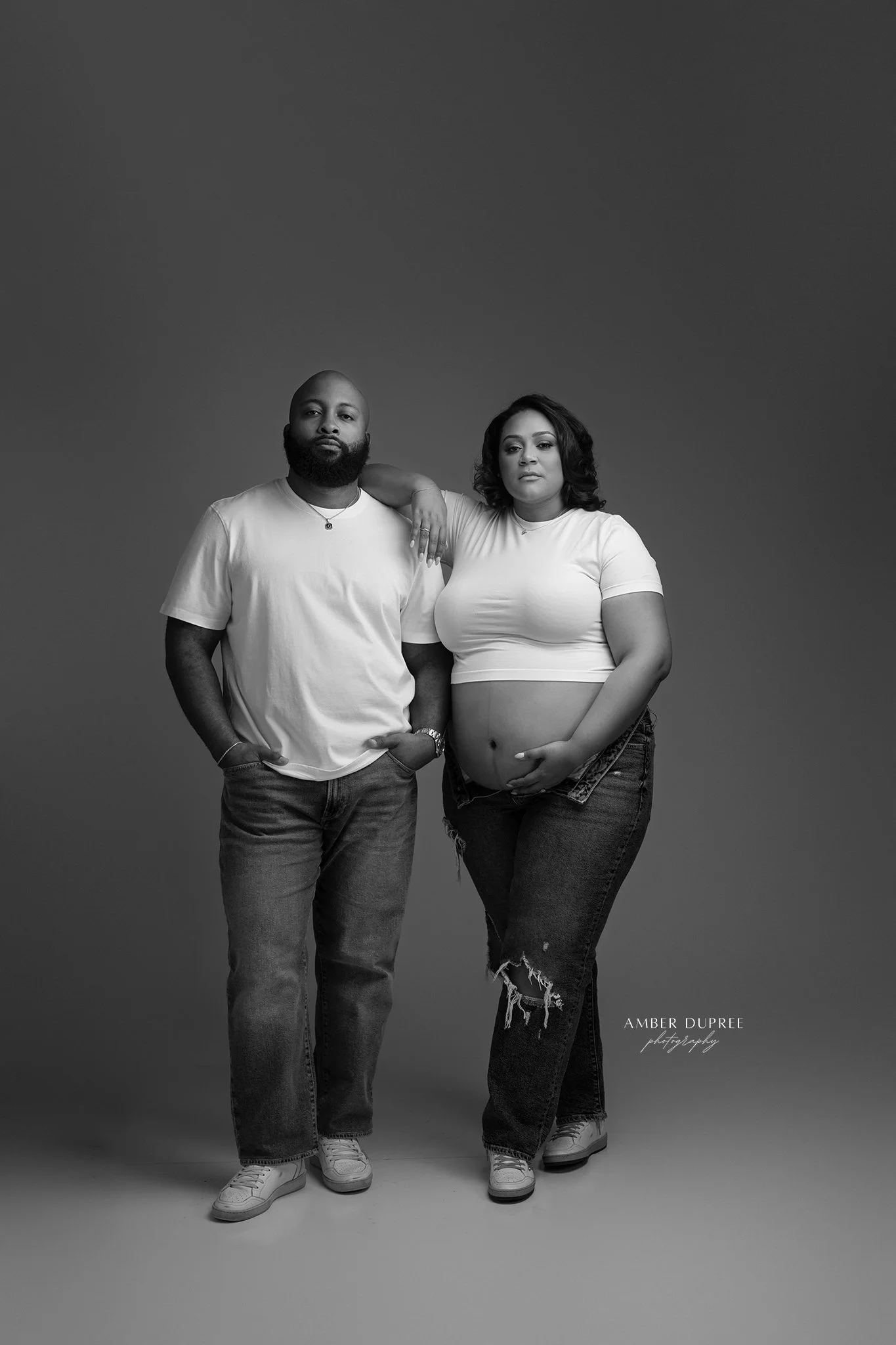 Luxury studio maternity photography session with a Nashville maternity photographer capturing timeless portraits of an expecting mother.