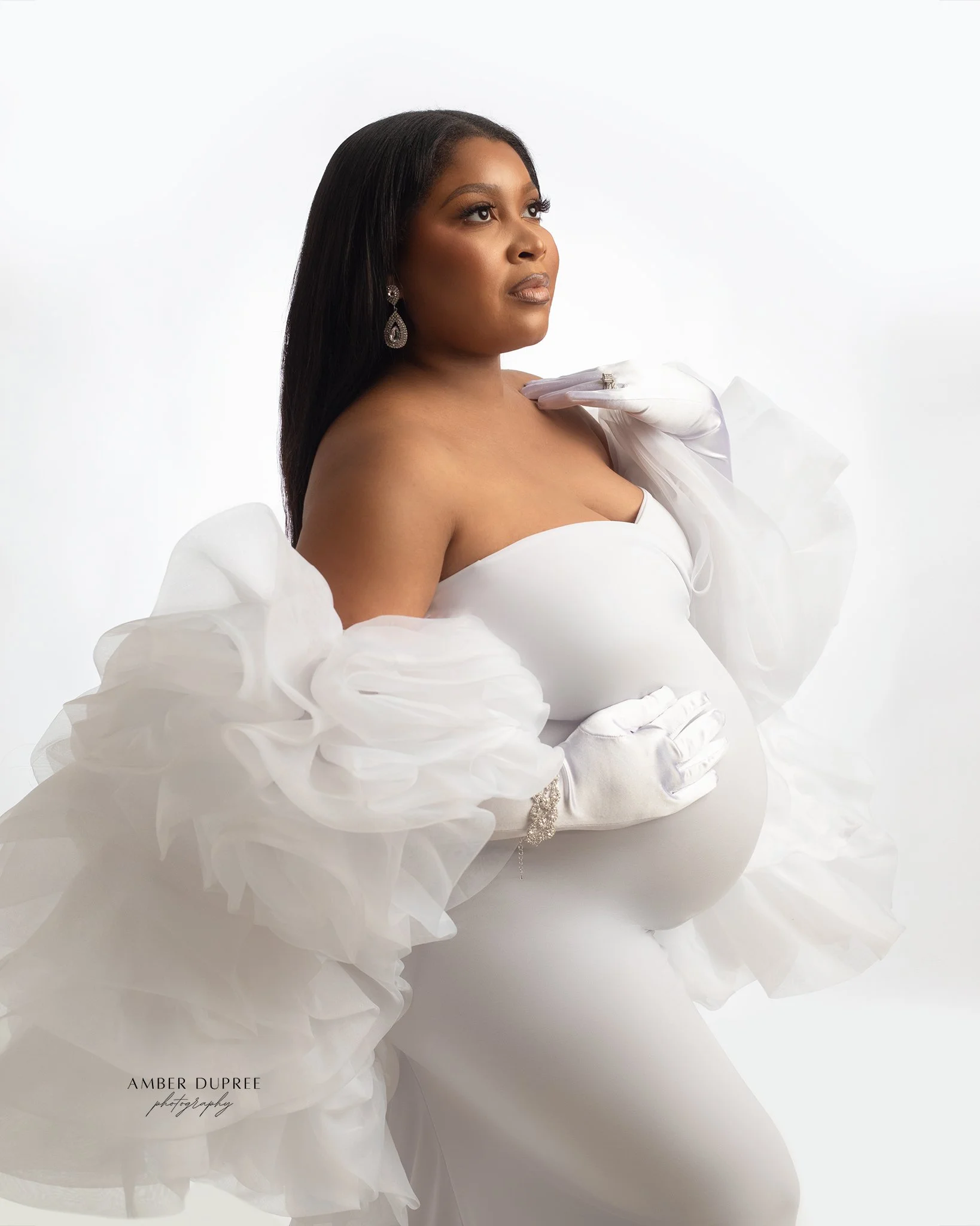 white backlit maternity photoshoot in nashville maternity studio