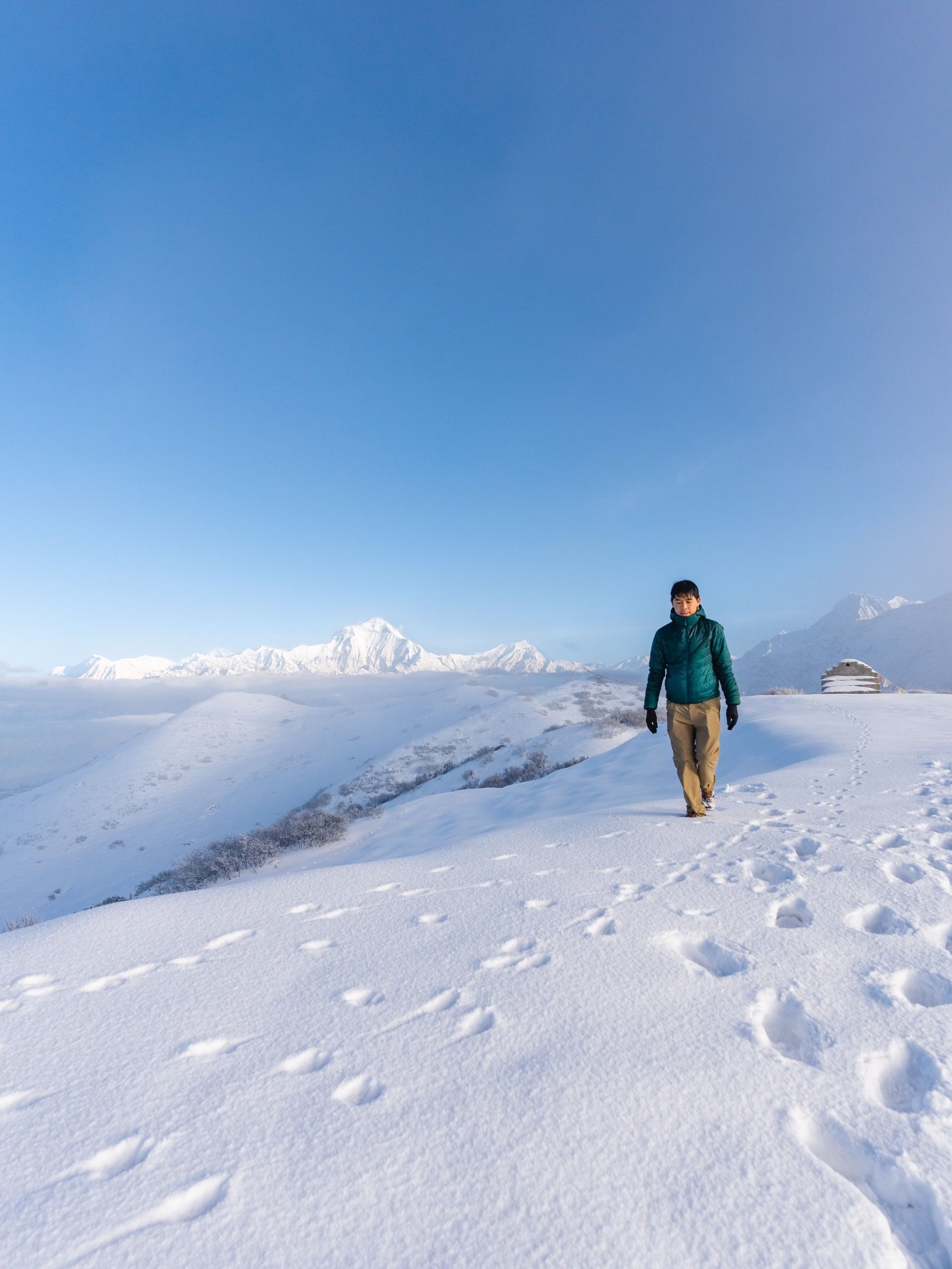 Winter vibes at an altitude of 3,600m in the Himalayas. We had a window of only 30 minutes for this view before thick mountain clouds came rolling in and covered everything. 
#TravelWithOMSYSTEM