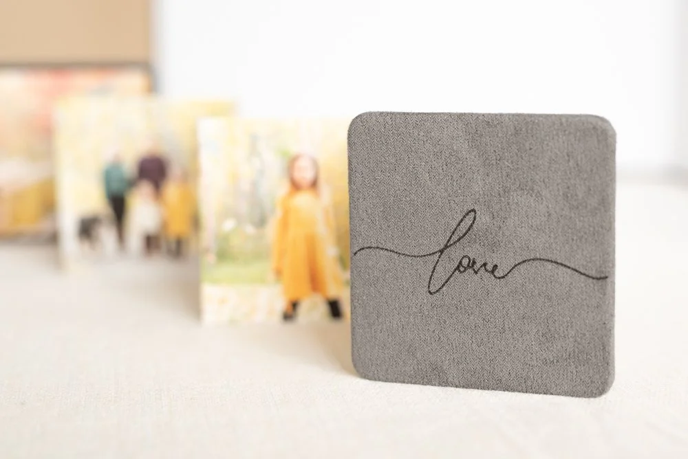 Beautiful Grey Accordion booklet on table to showcase photos for Calgary photography studio