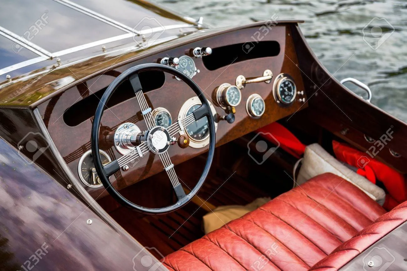 28274771-a-view-of-the-steering-wheel-and-dashboard-of-a-wooden-motor-boat.jpg