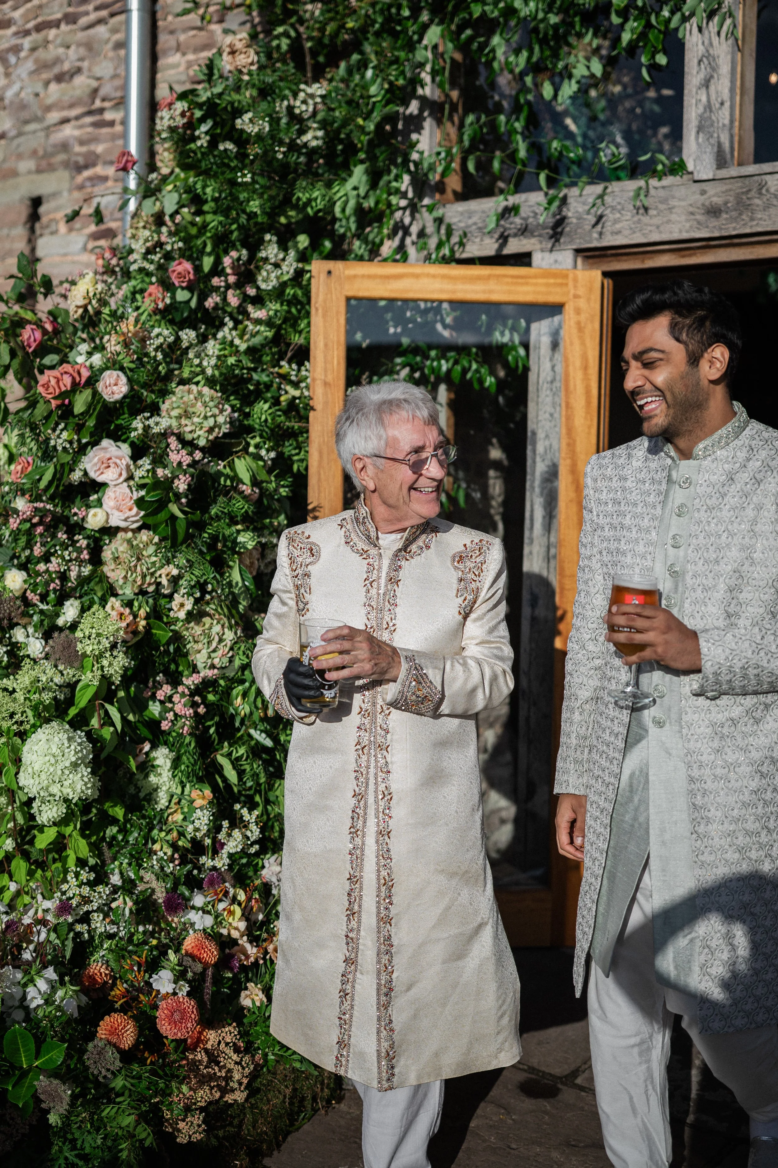 Large floral installation at a doorway to a wedding