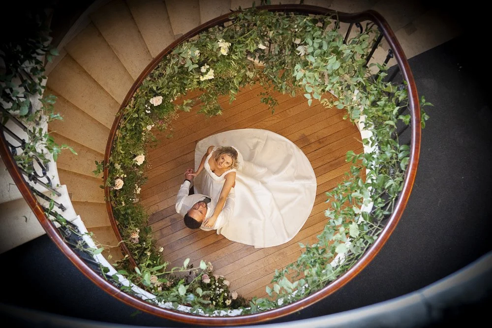Flower and foliage installation on a grand spiral staircase