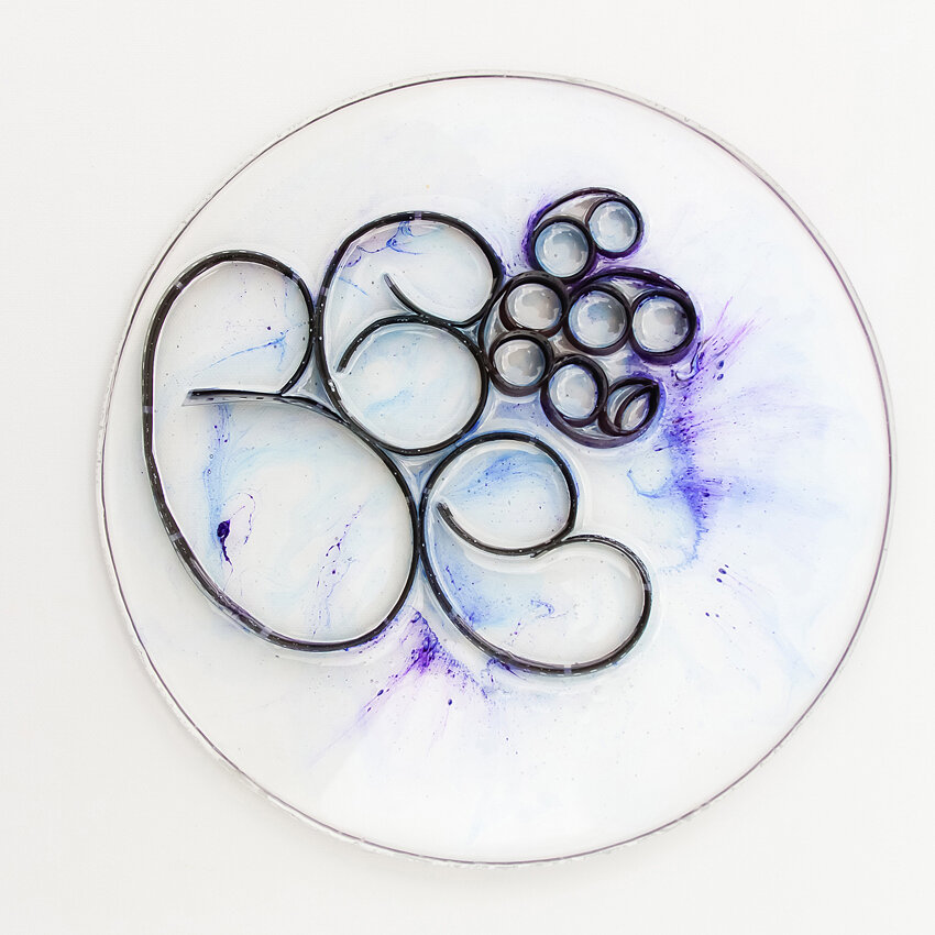   Title: Traces #1 Dimensions: 9” diameter, 1/3” depth Medium: Photographic film, resin, India ink, glass etching medium  