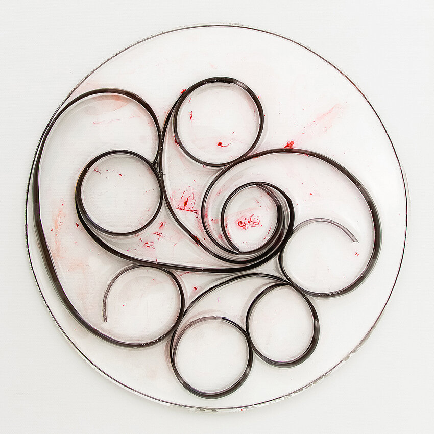   Title: Traces #22 Dimensions: 9”&nbsp; diameter, 1/3” depth Medium: Photographic film, resin, India ink, glass etching medium  