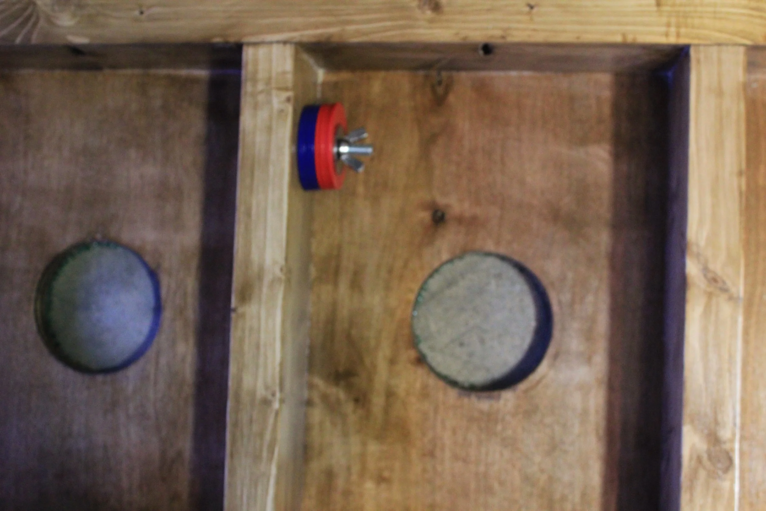 A simple carriage bolt with a wingnut to store your washers while not in use.