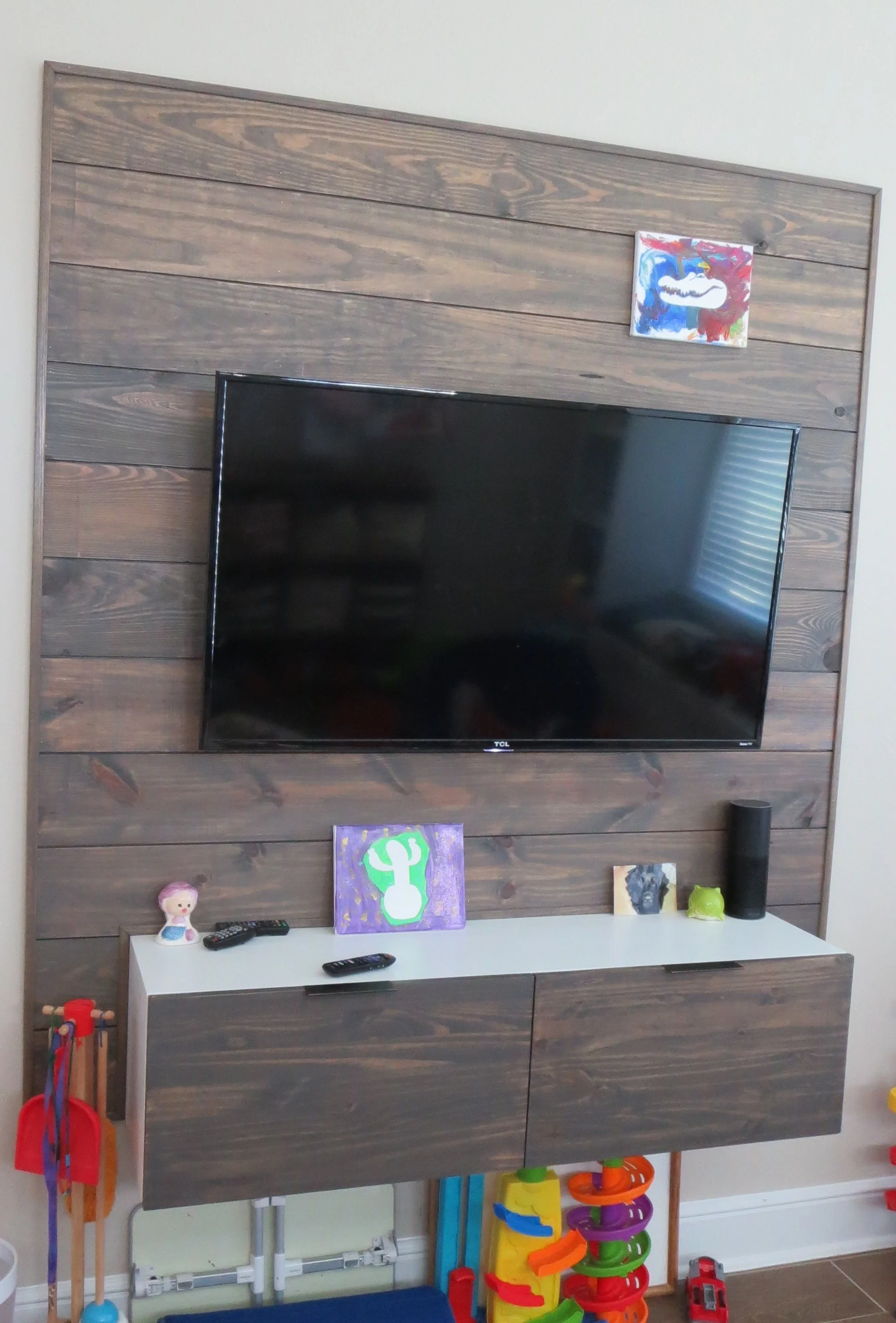Floated entertainment center shelf and TV accent wall