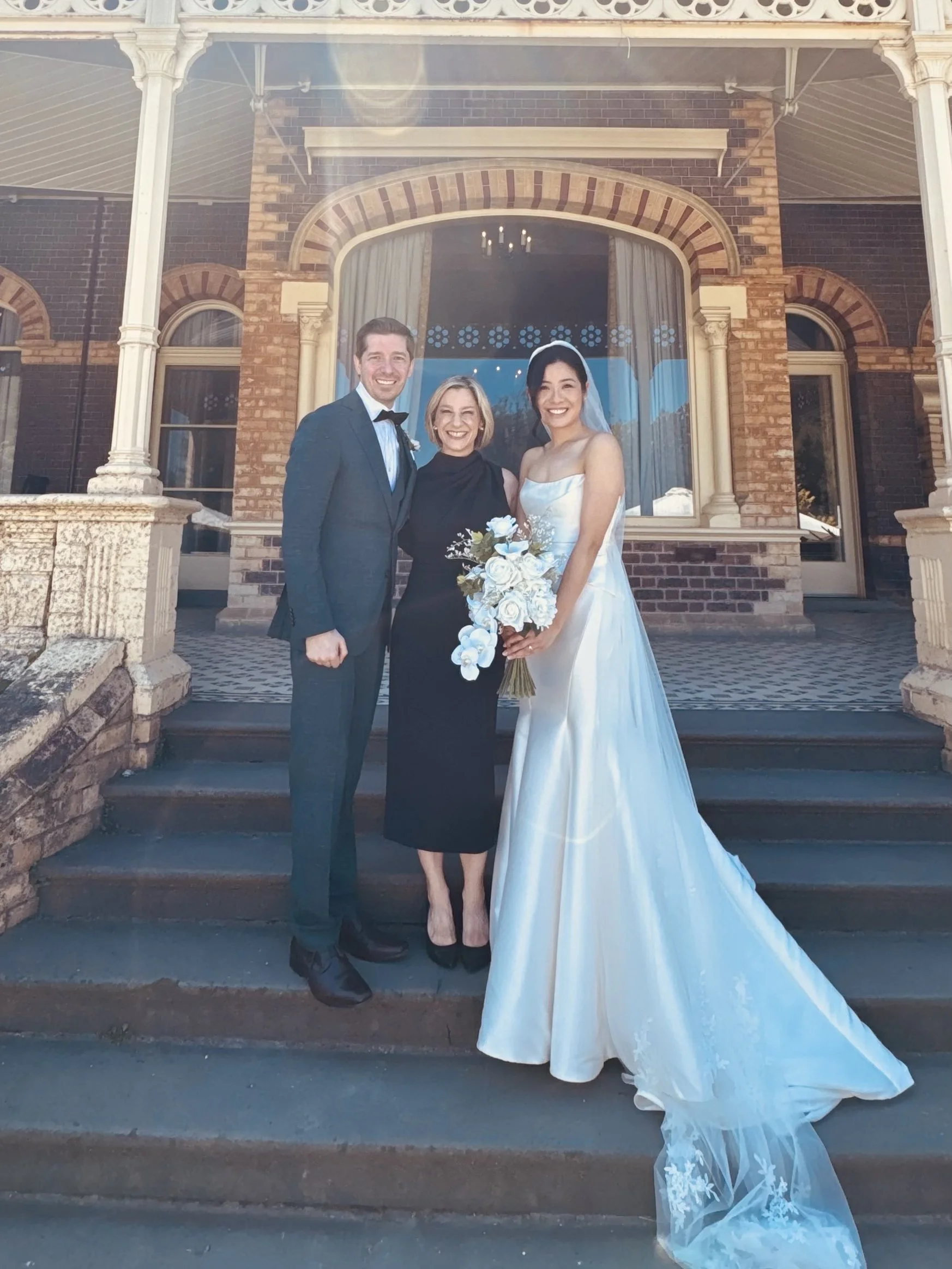 Marriage Celebrant Olivia Ferraro with happy couple at a wedding ceremony Rippon Lea Estate, Elsternwick