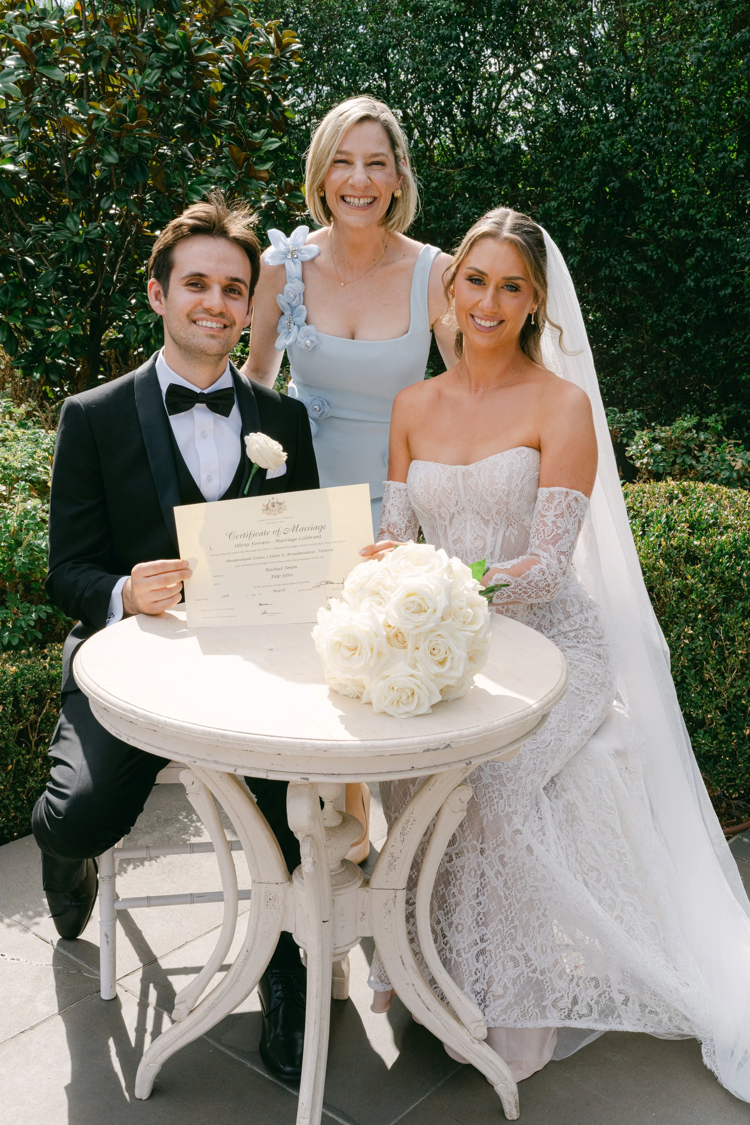 Marriage Celebrant Olivia Ferraro smiling with married couple at Meadowbank Estate, Broadmeadows