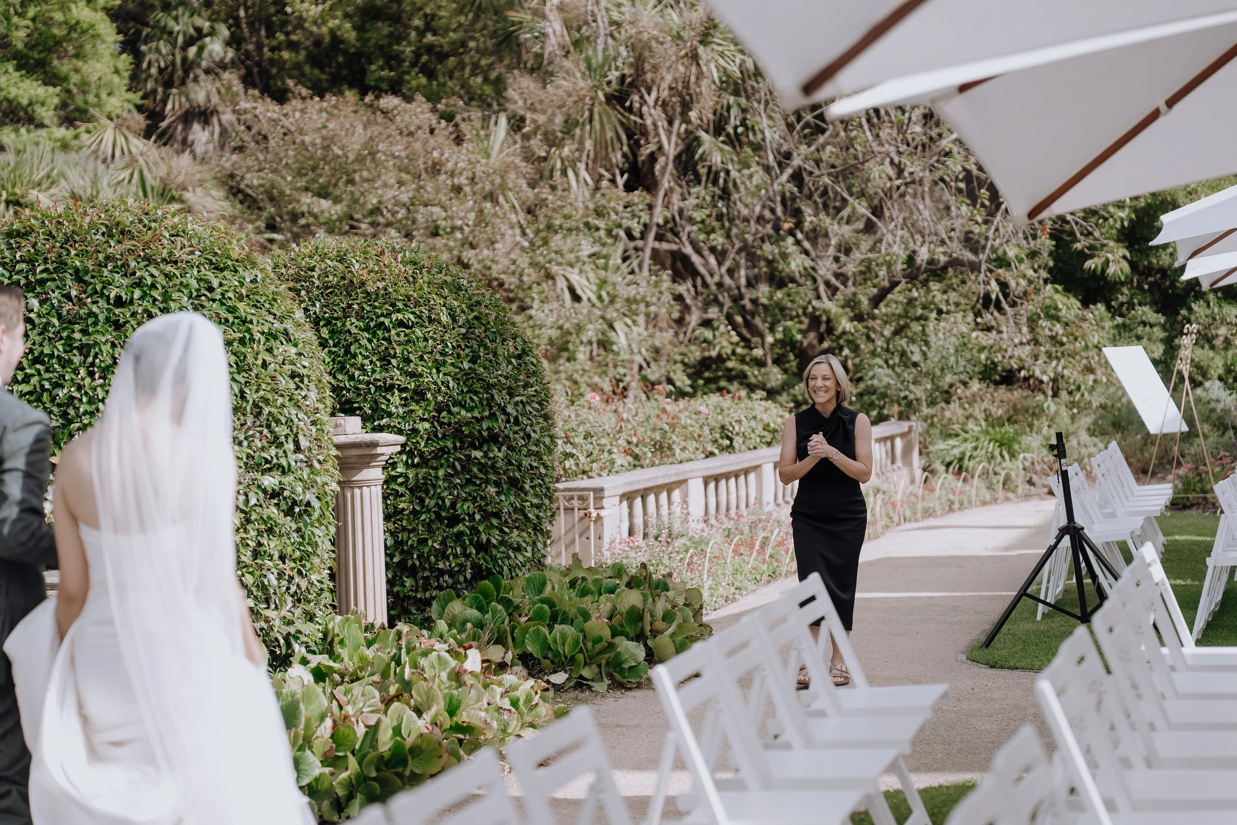 Happy Melbourne Wedding Marriage Celebrant, Olivia Ferraro, greets bride and groom during first look photos